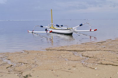 Nautical vessel on sea against sky