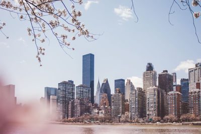 Modern buildings in city against sky