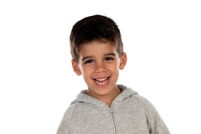 Portrait of smiling boy against white background