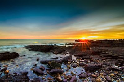 Scenic view of sunset over sea