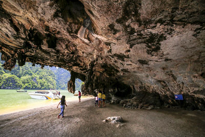 People by cave at beach