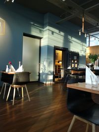 Empty chairs and tables in restaurant