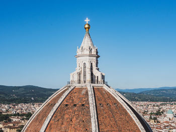 Low angle view of building against blue sky