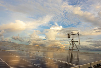 A radio mast on the roof, and solar panels on the roof