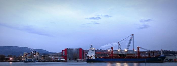 View of commercial dock against sky