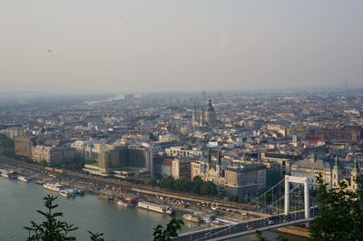 High angle view of river amidst buildings in city