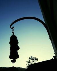 Low angle view of lamp post against blue sky