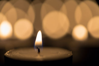 Close-up of lit tea light candles