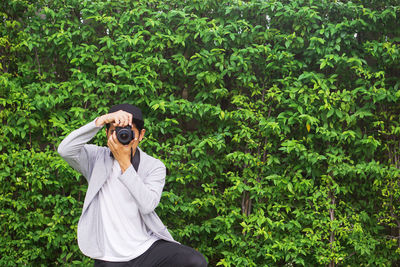 Man photographing with camera