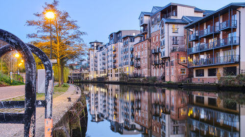 Reflection of illuminated buildings in canal