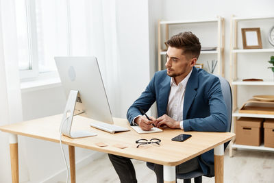 Young man working at office