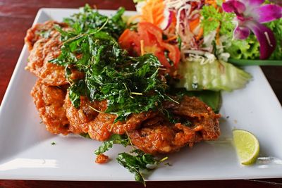 Close-up of salad served in plate on table