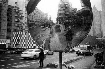 Digital composite image of people walking on city street