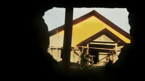 Silhouette of building against sky during sunset