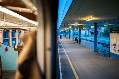 Cropped image of train at illuminated railroad station