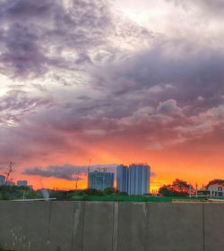 Buildings against sky during sunset