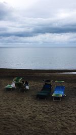 People on beach against sky