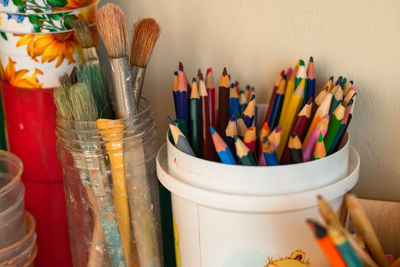 Wooden multi-colored pencils in a bucket