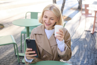 Young woman using mobile phone