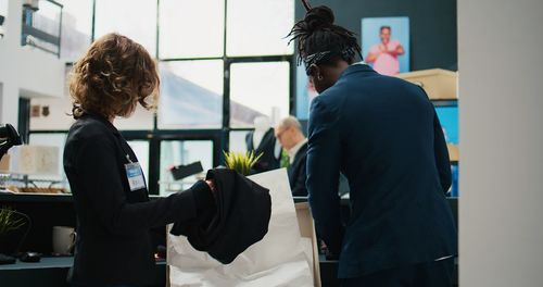 Rear view of business colleagues working in office