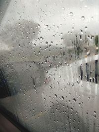 Full frame shot of raindrops on glass window