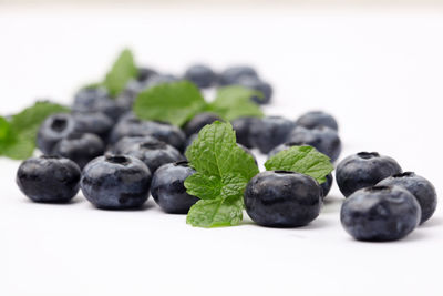 Close-up of blueberries against white background