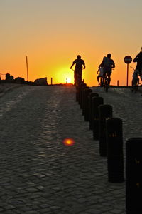 Silhouette of people at sunset