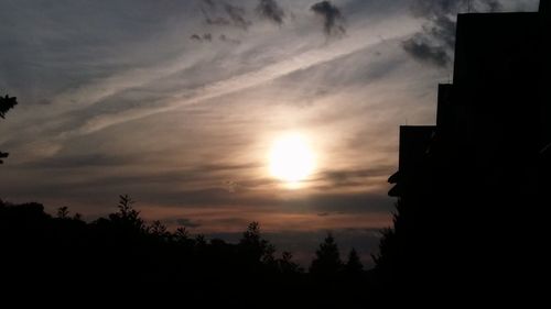 Low angle view of silhouette trees against sky during sunset