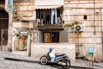 Bicycles on street against old building