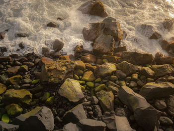 High angle view of stones on beach