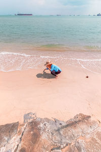 Person sitting on beach