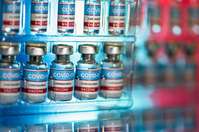 Close-up of bottles in shelf at store