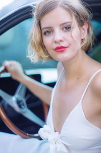 Portrait of beautiful woman in car