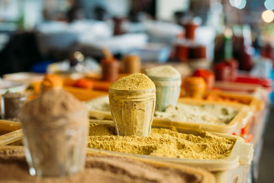 Close-up of spices for sale in container at market