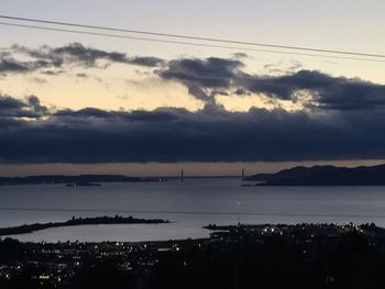 Clouds over city at sunset