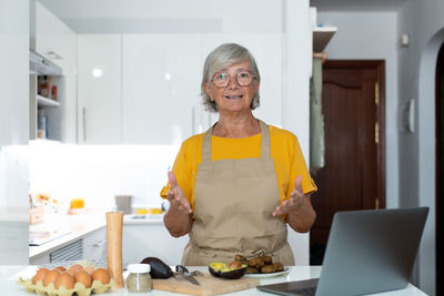 Portrait of young woman working at home