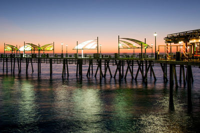 Pier over sea against clear sky