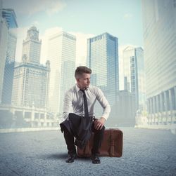 Man looking at city buildings