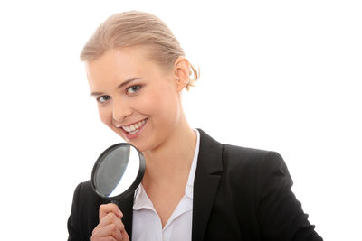 Portrait of a smiling young woman over white background