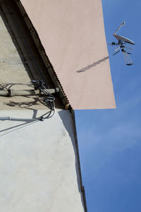 Low angle view of airplane against sky