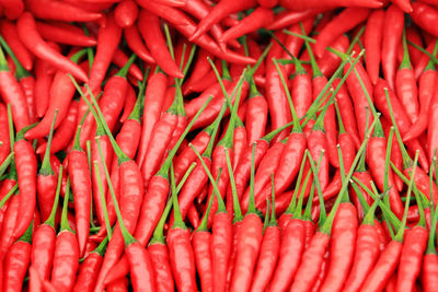 Full frame shot of red chili peppers for sale in market