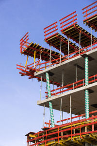 Low angle view of construction site against clear sky