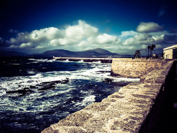 Panoramic view of beach against blue sky