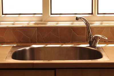 Faucet and sink in kitchen