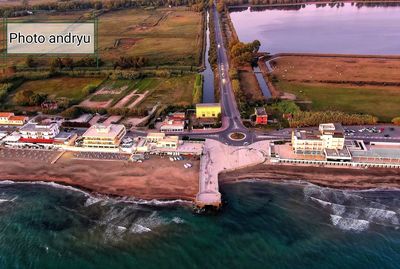 High angle view of buildings by sea