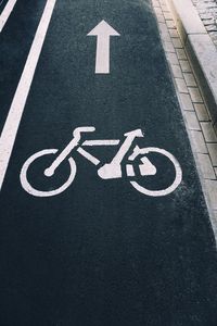 High angle view of arrow sign on road