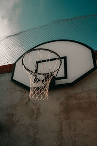 Low angle view of basketball hoop against sky