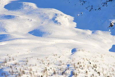 Scenic view of mountains against cloudy sky