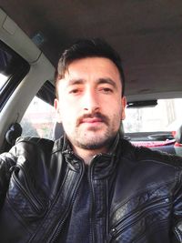 Portrait of man in car