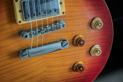 High angle view of guitar on table